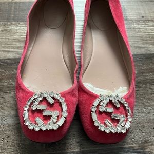 Pink suede Gucci ballet flats.